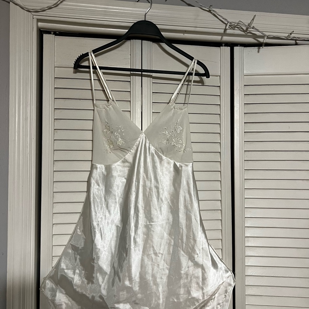 White Mini Dress with Spaghetti Straps and Flowing Silhouette